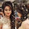 This style is created by weaving the braids into the rest of the hair on the sides and creating a simple bun in the back. 3