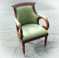 The mahogany frame, with carved front legs, has brass castors. Post 1950 Green Leather Vatican