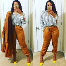 Black And Orange Cargo Pants This Work Outfit Idea Features And Burnt Orange Trench Coat From The Micheal Kors 2018 Collection Burnt Oran Orange Pants Outfit Pants Outfit Work Work Outfit