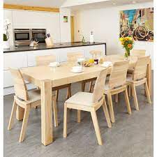 These tables are a fantastic option for people who like to host the occasional dinner party with friends and family but are looking for a space conscious table the rest of the time. Olten Light Oak Six Seat Extending Dining Table With Six Cream Chairs Light Oak Dining Table Kitchen Table Oak Dining Table