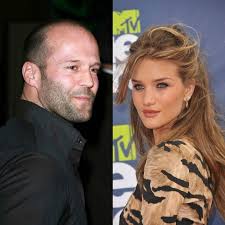 This jason statham photo might contain business suit, street, city scene, urban setting, long trousers, and long pants. Pin By Mariajose Lucianooliveira On Shirebrook Reino Unido Jason Statham Jason Statham And Rosie Statham