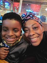 This my lil great nephew ya'll. I call him Bud E Lee and he's one of the  sweetest kids I know. When I passed him his Christmas gift (he loves money  and