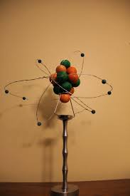 Model Of An Oxygen Atom 8 Neutrons 8 Protons And 8 Electrons All Wooden Attached On A Candle Holder Science Projects Atom Model Project Science For Kids
