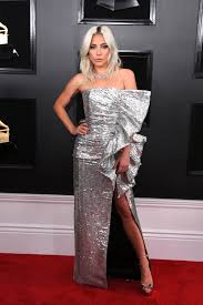 Bebe rexha heated up the red carpet wearing a plunging red monsoori gown with layers and layers of ruffles cascading down a full skirt. Grammys Best Dressed Celebrities On The Red Carpet 2019