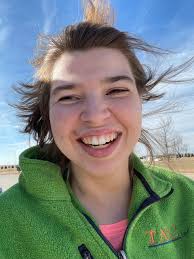 Enjoying the nice weather & breeze blowing her hair. 🙂