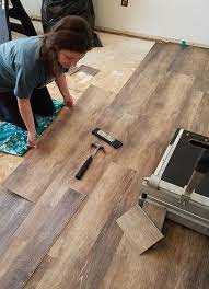You'll need to secure your flooring to the underlayment with a few tacks from a hammer or a nail gun. How To Install Vinyl Plank Flooring Plank Flooring Diy Installing Vinyl Plank Flooring Diy Flooring