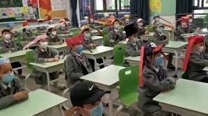 Chinese Children Must Wear One Metre Hats To Keep Social Distancing As They Return To School Daily Mail Online