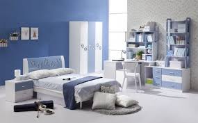 In this room, several fun patterns come together for a stylish mix. Cool Blue And White Boys Bedroom Design With Curve White Study Desk And Three Doors Closet Modern Kids Bedroom Blue Rooms Blue Bedroom