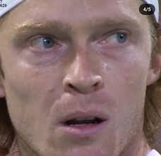 Just a joke in the @copperboxarena corridor. @jimchardy walks through the  players' lounge, grabs the photographer's camera, and takes a close  portrait of @andreyrublev. The photographer captures the moment with his old