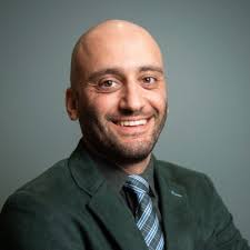 With my colleague, Professor Marco Salviato, I stand in front of our new  Automated Fiber Placement (AFP) robot at the University of Washington to  fabricate aerospace composite parts.