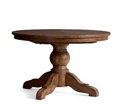 A Rustic Light Pine Finish Brings Casual Warmth To The Sumner Extending Pedestal Dining Table The Wood I Pedestal Dining Table Dining Table Round Dining Table