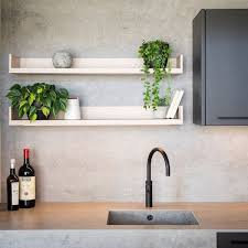 Neutral colored countertops and wooden open shelving keep this kitchen feeling natural. Dekton Worktops For Kitchens Dekton Countertops