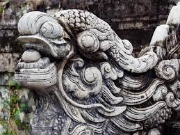 The applied/inlayed eyes appear to be moon stones or similar, possibly dark pearls. Vietnamese Guardian Lion Stock Photo Image Of Mountains 124768062