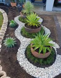 Beautiful Setting For Planters Modern Design Rock Garden Landscaping Garden Decor Projects Backyard Garden Design