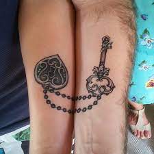 Together they are enveloped in the colorful heart of love surrounded by sweet words. 30 Couple Tattoo Ideas Cuded Best Couple Tattoos Couple Tattoos Love Cute Couple Tattoos