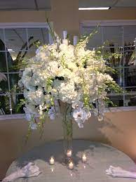 Phalenopsis Orchids Cascade Of This Arrangement Of Dendrobium Orchids Roses And Hydrangeas Arrangement Dendrobium Orchids Orchids