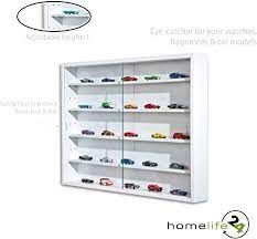 These do not normally stick out from the wall very much, and they may be made with chrome they are an excellent way to help in sprucing up a blank wall area. Display Collection Cabinet Glass Display Case Wall Mounted Wall Display Unit With Glass Doors Adjustable Shelves In White Finish Amazon De Home Kitchen