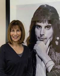 Freddie's Sister Kashmira next to her favorite photograph of Freddie Framed  in her apartment