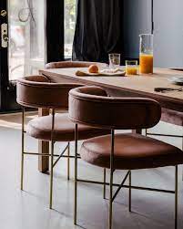 These Blush And Gold Chairs Are Audrey Custom Dining Chairs From Interior Define Gathered Around An Custom Dining Chairs Dining Chair Design Pine Dining Table
