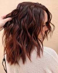 She has thick wavy hair ; 20 Dark Auburn Hair Color Ideas Trending In 2020