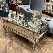 On sale for $352.65 original price $399.90. Belfry 4 Drawer Champagne Gold Mirrored Coffee Table Picture Perfect Home