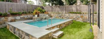 Small space pool and spa design with turf landscape. Pool Construction Tips For Tiny Backyards Shoreline Pools