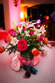 Set of 5 varying size square vases each with it's own unique arrangement. Vibrant Floral And Sand Vase Centerpieces
