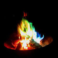 Colorful Campfire Burning Christmas Lights It Works We Do It At Hodag Every Year Gets Rid Of Those Light Outdoor Fire Pit Fire Pit Backyard Backyard Decor