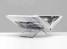 This exclusive occasional table makes a dynamic statement in front of the sofa while providing a convenient spot to place a glass, book or plant. Youngmenheaven Acrylic Coffee Table Book Stand