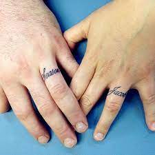 35 Romantic Wedding Ring Finger Tattoo Designs And Ideas Wedding Ring Finger Tattoos Ring Tattoo Designs Wedding Finger Tattoos