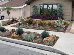 The garden is divided into different areas, including chaparral, fruit trees, cut flowers, berry patch, banana bed and vegetable garden. Drought Tolerant Landscaping Orange County Ca Drought Resistant Pl Xeriscape Front Yard Low Maintenance Landscaping Front Yard Front Yard Landscaping Design