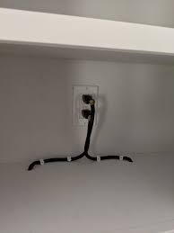 Is it worth the money to have an under cabinet outlet strip with lights versus the outlets on the backsplash? How Can I Clean This Up Inside Kitchen Cabinets Goes To Under Cabinet Power Strips Done By An Electrician Electricians