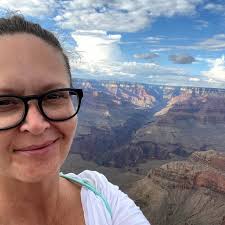 Teresa Helm (2nd R), an abuse victim of Jeffery Epstein, smiles as she  walks with a group of women after they spoke behind closed doors with the  House Oversight Committee at the