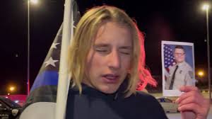 Mile 1,668:, Honoring fallen Coweta County Georgia Deputy Sheriff Eric  Minix with a 1-mile run carrying the Blue Line Flag., Youth Runner: Andrew 