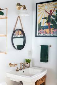 You can hold all of your essentials, like lotion, cotton balls and tweezers. 1001 Ideas For Amazing Bathroom Wall Decor Ideas For Every Taste