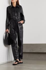 Nanushka delivers a modern, versatile, day to night wardrobe for the modern human with the aim of creating a new informal form of beauty. Black Ashton Belted Vegan Leather Jumpsuit Nanushka Net A Porter