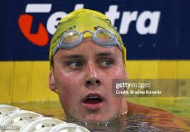 Glenn Tasker and Neil Martin of Swimming Australia with Ryan Mitchell...  News Photo
