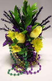 Get into the spirit of mardi gras with this fun and festive centerpiece! Blossoms By The Beach Mardi Gras Centerpieces Mardi Gras Wedding Mardi Gras Decorations