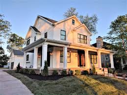Second story ipe deck spans nearly the length of the back of the home, creating a spacious outdoor space. 2 Story With Wrap Around Porch Kil Architecture
