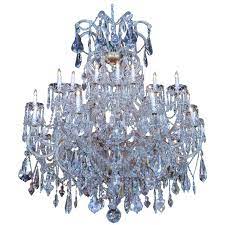 The fire and brilliance of the crystal comes from the reflection of light passing through the prism. Large Swarovski Crystal Chandelier With 24 Lights For Sale At 1stdibs