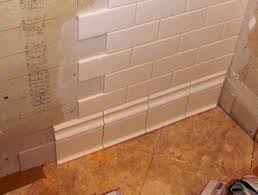 Need Help With Quot Baseboard Quot Tiles Not Cove Caulk Grout Gaps Tile Baseboard Cheap Bathroom Remodel Diy Bathroom Remodel