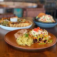 Mit 3,5/5 von reisenden one large burrito filled with beef fajita and refried beans, topped with chile con carne sauce and yellow cheese. La Cosecha Restaurant New Braunfels Tx Opentable