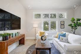 Maybe you would like to learn more about one of these? Family Room Features White Slipcovered Sofas Facing Wooden Cocktail Stock Photo Picture And Royalty Free Image Image 89945965
