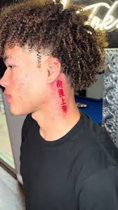 Black Men behind Ear Tattoos