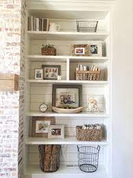 Built In Bookshelves Styling And Decor Shiplap Whitewash Brick Fireplace Rustic Mantle Baskets Living Room Shelves Bookcase Decor Interior