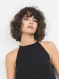 It will look amazing on women with very curly hair. 35 New Bob With Bangs Bob Haircut And Hairstyle Ideas Hair Styles Curly Hair Styles Curly Hair Styles Naturally