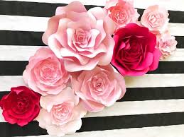 Pink and black paper flowers. How To Make A Cool Backdrop With Large Paper Flowers Emmaline Bride Wedding Blog