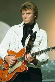 Two of johnny hallyday's children are to contest the french rock star's will as simmering family tensions threatened to boil over after he left his entire fortune and all his artistic rights. Johnny Hallyday The Elvis Of France Dies At 74 Vogue