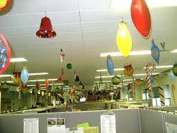 Decorate the room with bright and fun decorations and offer a reward for the most impressive sweater. Creative Inspirational Work Place Christmas Decorations Godfather Style