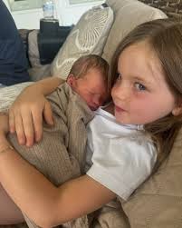 One week of pure magic with baby brother 💙✨🥹 The girls are seriously  obsessed. We have to have a schedule so we don't fight about who holds him.  I am worried he